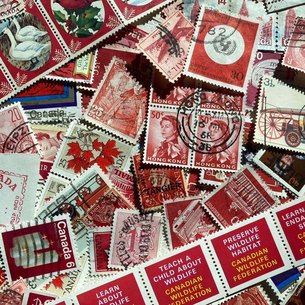 100 Red Postage Stamps off paper